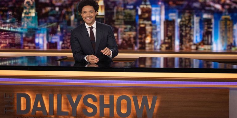 Trevor-Noah-behind-his-Daily-Show-desk.jpg