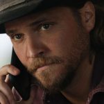 yellowstone-512-hed-kayce-phone.jpg
