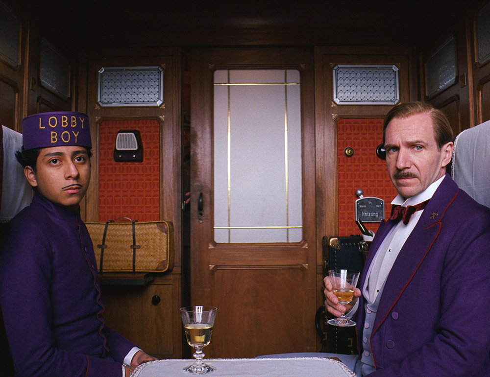 THE GRAND BUDAPEST HOTEL, from left: Tony Revolori, Ralph Fiennes, 2014.