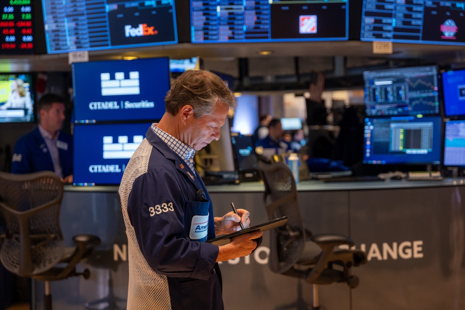 Traders work on the floor of the New York Stock Exchange