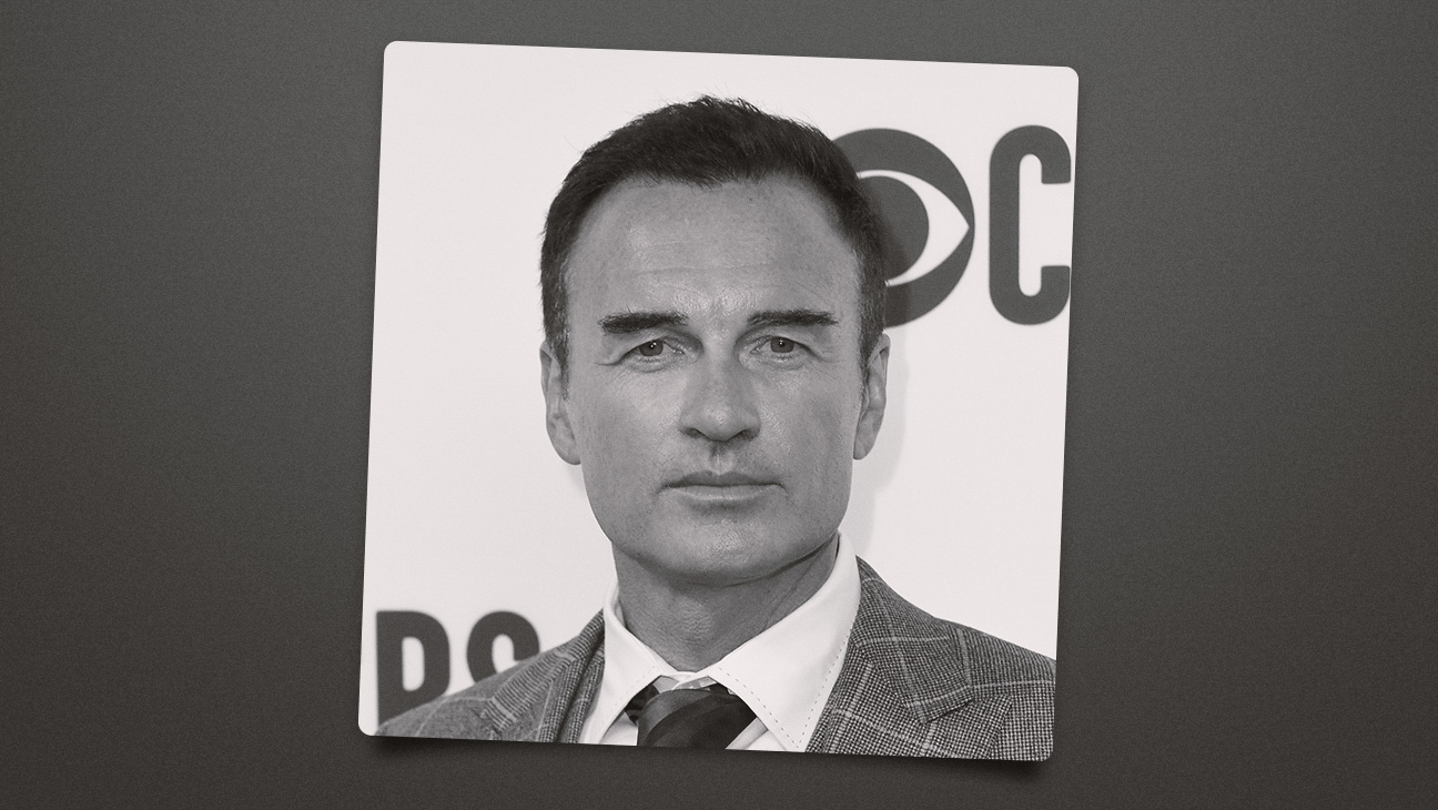 Julian McMahon on the red carpet in a black and white photo